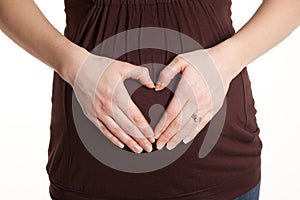 Hand Heart on Pregnant Belly