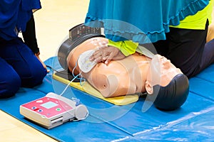 Hand Heart pump with medical dummy on CPR, in emergency refresher training to assist of physician