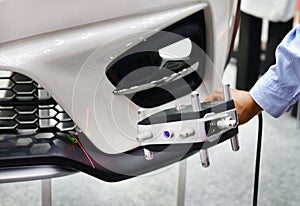 Hand-held 3D laser scanners measure the accuracy of automotive parts.