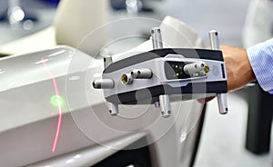 Hand-held 3D laser scanners measure the accuracy of automotive parts.