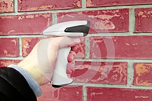 Hand Held Barcode Scanner on man hand