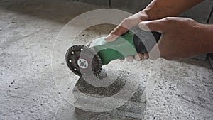 Hand-held brick cutter for garden accommodation construction