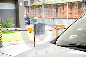 Hand held card to the scanner to open the car park door. security system for parking.