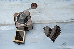 Hand-held coffee grinder