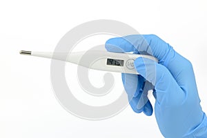 Hand held digital thermometer, blue glove