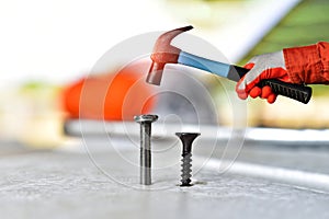 hand-held nails in a construction site