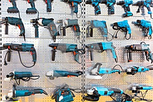 Hand-held power tools on stand in store