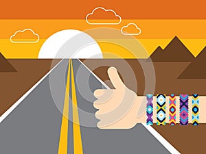Hand with hippy friendship bracelets hitchhiking photo