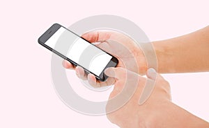 Hand hol black phone isolated on pink background, blank screen photo