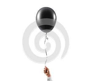 Hand hold blank black balloon mock up isolated. Balloon art.
