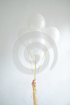 Hand hold blank white balloon mock up isolated