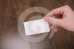 Hand hold blank white card mockup with rounded corners. Plain call-card mock up template holding arm. Plastic credit namecard