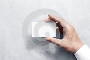 Hand hold blank white card mockup with rounded corners