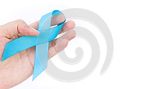 Hand hold blue ribbon on white background prostate cancer awareness concept