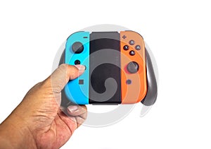 A hand hold a Console game Joy-Con controllers isolated on white background.