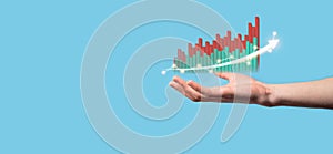 Hand hold drawing on screen growing graph, arrow of positive growth icon.pointing at creative business chart with upward arrows.