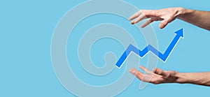 Hand hold drawing on screen growing graph, arrow of positive growth icon.pointing at creative business chart with upward arrows.