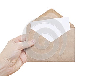 Hand hold a envelope and post card isolated white background. Close up