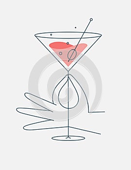 Hand hold glass of cosmopolitan cocktail