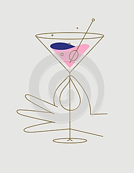 Hand hold glass of cosmopolitan cocktail beige