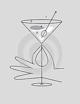 Hand hold glass of cosmopolitan cocktail grey