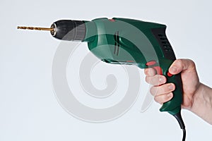 Hand hold green drill