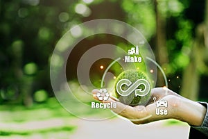 Hand hold the Green earth with circular economy icon. Business and environment sustainable of concept of eternity, endless,