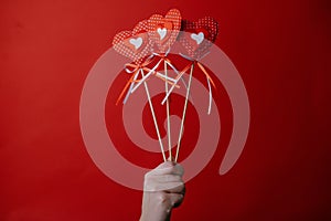 hand hold heart red lollipops sweet dessert on stick dark background valentines day theme