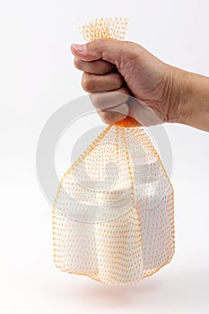 Hand hold the net bag medicine bottle