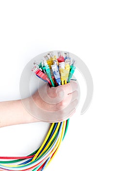Hand hold network wires assorted colors with tips on white background top view