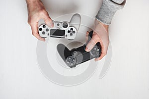 Hand hold new joystick isolated. Gamer play game with gamepad controller. Gaming man holding simulator joypad. Person with keypad