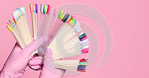 Hand hold pedicure and manicure samples for nails salon and spa brush nail on pink