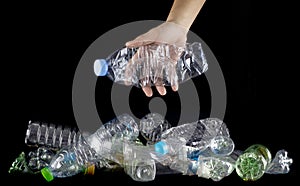 Hand hold plastic bottles to discard