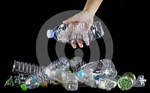 Hand hold plastic bottles to discard photo