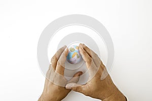 Hand hold plastiline symbol of planet Earth globe