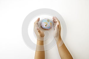 Hand hold plastiline symbol of planet Earth globe