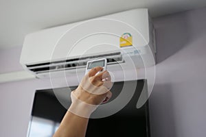 Hand hold remote control directed on the air conditioner