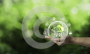 Hand hold world on greenery background and CO2 reducing for decrease carbon footprint and credit to limit global warming from