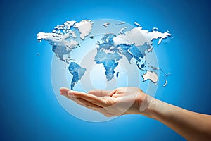 Hand hold world map on blue background for globalization concept photo