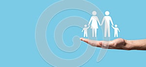 Hand hold young family icon. Family life insurance,supporting and services,family policy and supporting families concepts.Happy