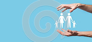 Hand hold young family icon. Family life insurance,supporting and services,family policy and supporting families concepts.Happy