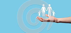 Hand hold young family icon. Family life insurance,supporting and services,family policy and supporting families concepts.Happy