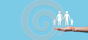 Hand hold young family icon. Family life insurance,supporting and services,family policy and supporting families concepts.Happy