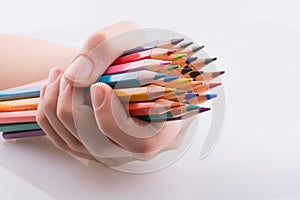 Hand holdin pencils