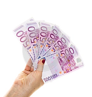 Hand holding 500 euro money isolated on white background