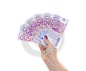 Hand holding 500 euro money isolated on white background