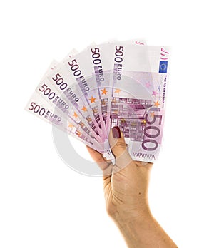 Hand holding 500 euro money on white background