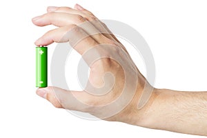 Hand holding an AA battery, isolated photo