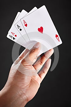 Hand holding Aces