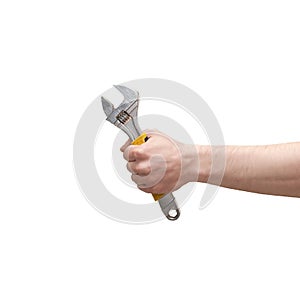 Hand holding adjustable wrench isolated on white background
